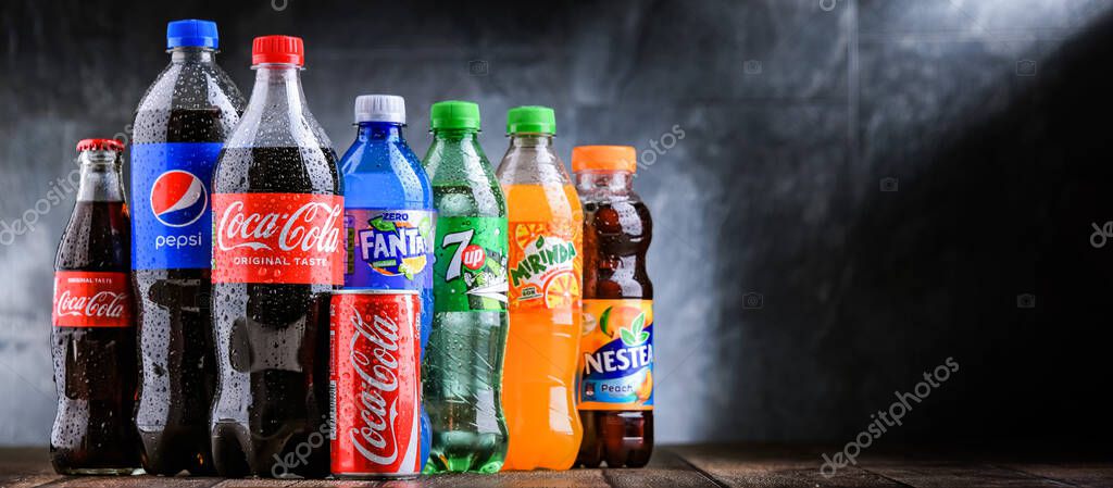 POZNAN, POLAND - OCT 28, 2021: Bottles of global soft drink brands including products of Coca Cola Company and Pepsico