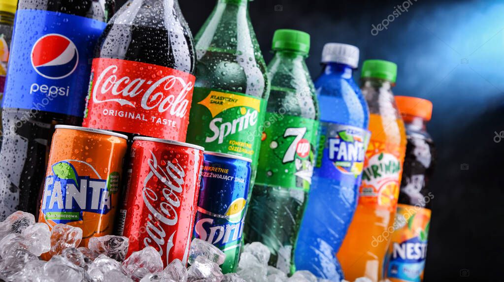POZNAN, POLAND - OCT 28, 2021: Bottles of global soft drink brands including products of Coca Cola Company and Pepsico