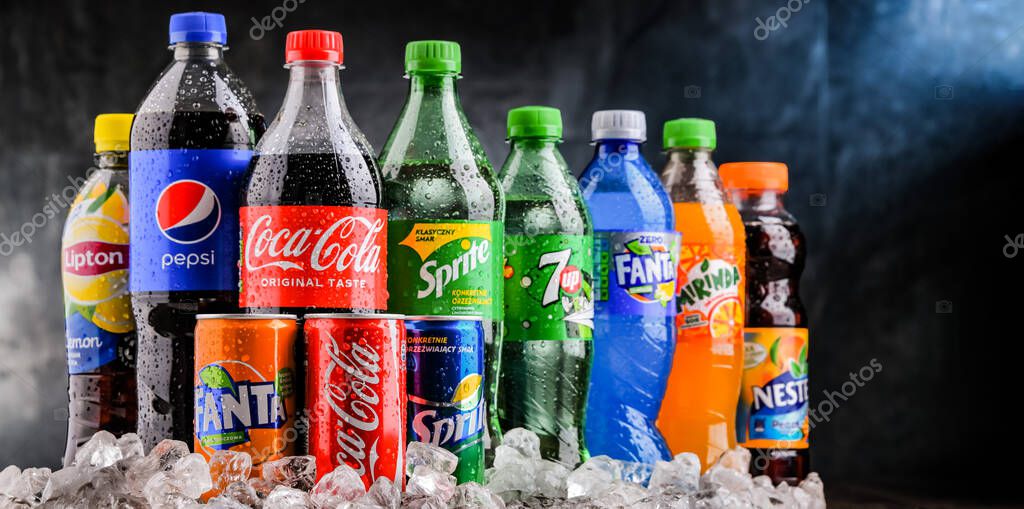 POZNAN, POLAND - OCT 28, 2021: Bottles of global soft drink brands including products of Coca Cola Company and Pepsico