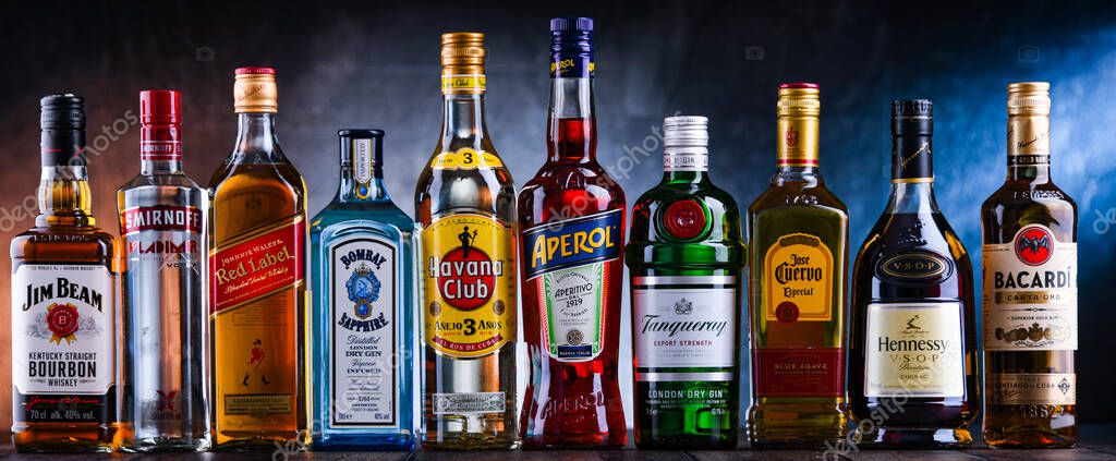 POZNAN, POL - NOV 4, 2021: Bottles of assorted global hard  liquor brands including whiskey, vodka, tequila and gin
