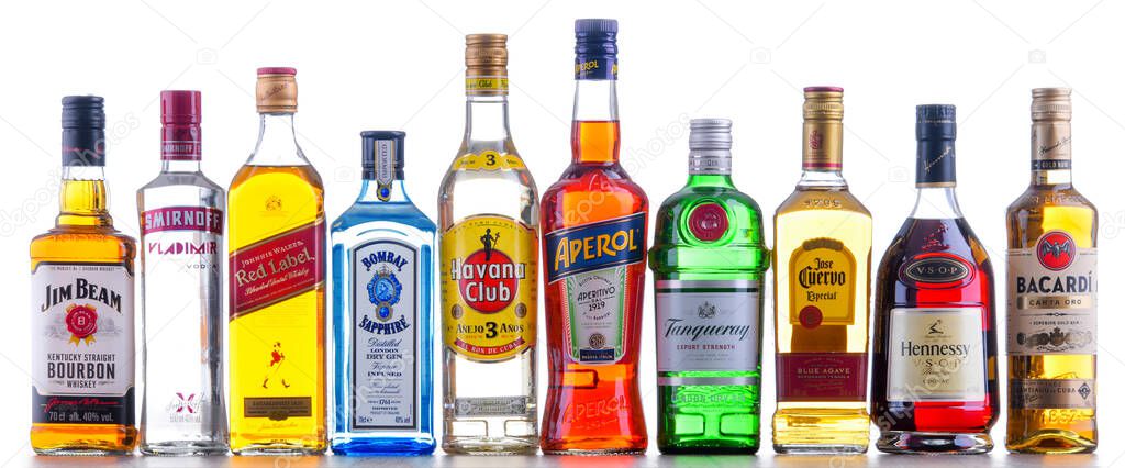 POZNAN, POL - NOV 4, 2021: Bottles of assorted global hard  liquor brands including whiskey, vodka, tequila and gin