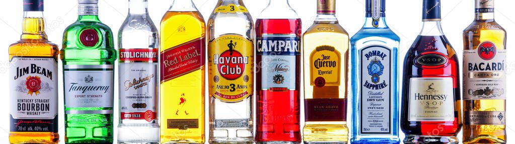 POZNAN, POL - NOV 4, 2021: Bottles of assorted global hard  liquor brands including whiskey, vodka, tequila and gin