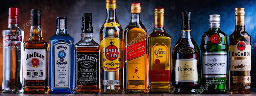 POZNAN, POL - NOV 4, 2021: Bottles of assorted global hard  liquor brands including whiskey, vodka, tequila and gin