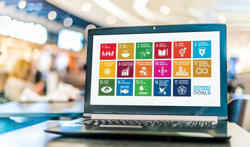POZNAN, POL - NOV 20, 2021: Laptop displaying logo of The Sustainable Development Goals, a collection of 17 interlinked global goals set up in 2015 by the United Nations General Assembly