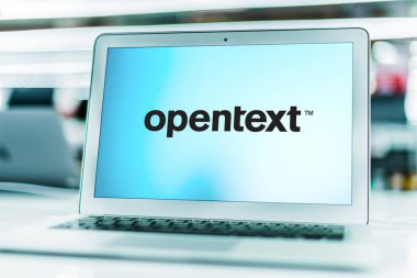 POZNAN, POL - APR 15, 2021: Laptop computer displaying logo of OpenText Corporation, a company that develops and sells enterprise information management (EIM) software clipart