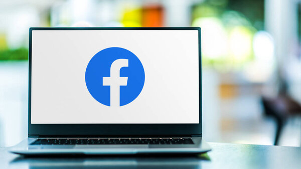 POZNAN, POL - FEB 6, 2021: Laptop computer displaying logo of Facebook, an American online social media and social networking service company based in Menlo Park, California