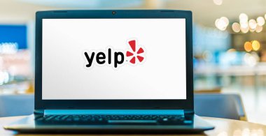 POZNAN, POL - JAN 6, 2021: Laptop computer displaying logo of Yelp, an American public company headquartered in San Francisco, California clipart