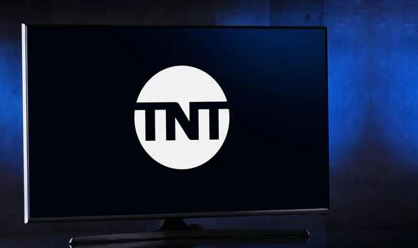 Stock image POZNAN, POL - MAR 25, 2022: Flat-screen TV set displaying logo of TNT, an American basic cable television channel owned by WarnerMedia Studios & Networks