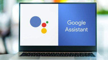 POZNAN, POL - SEP 22, 2021: Laptop computer displaying logo of Google Assistant, an artificial intelligence powered virtual assistant developed by Google