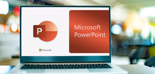 POZNAN, POL - DEC 12, 2021: Laptop computer displaying logo of Microsoft PowerPoint, a presentation program, part of the Office family software and services developed by Microsoft