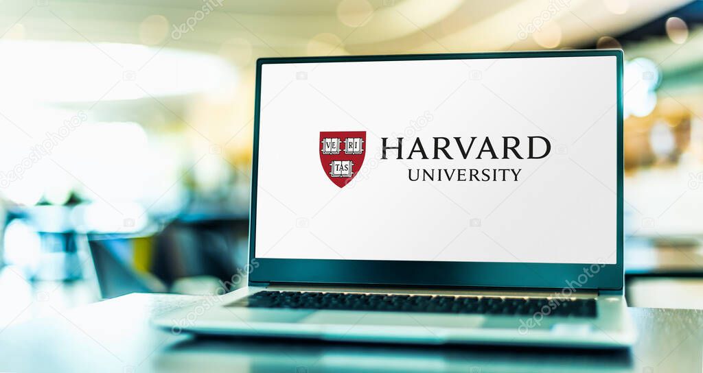 POZNAN, POL - APR 20, 2021: Laptop computer displaying logo of Harvard University, a private Ivy League research university in Cambridge, Massachusetts
