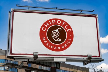 POZNAN, POL - MAY 1, 2022: Advertisement billboard displaying logo of Chipotle Mexican Grill, an American chain of fast casual restaurants