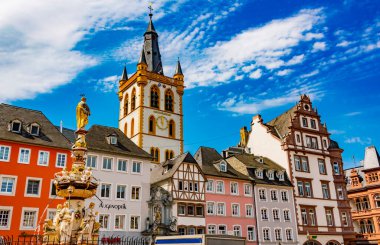 TRIER, GERMANY - AUG 4, 2022: Monumental architecture of Trier main market with St. Gangolf's Church, in the state of Rhineland-Palatinate, Germany