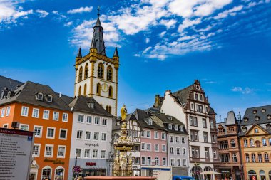TRIER, GERMANY - AUG 4, 2022: Monumental architecture of Trier main market with St. Gangolf's Church, in the state of Rhineland-Palatinate, Germany