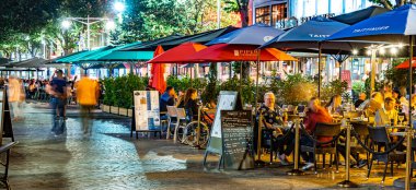 REIMS, FRANCE - AUG 6, 2022: Restaurants in the old town of Reims, France in the night