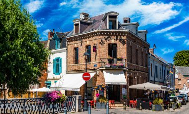 REIMS, FRANCE - AUG 6, 2022: Restaurants at the Somme river in the old town of Amiens, France