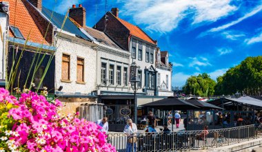 REIMS, FRANCE - AUG 6, 2022: Restaurants at the Somme river in the old town of Amiens, France
