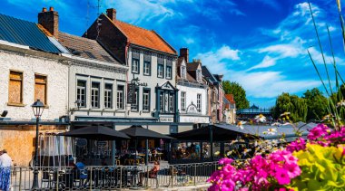 REIMS, FRANCE - AUG 6, 2022: Restaurants at the Somme river in the old town of Amiens, France