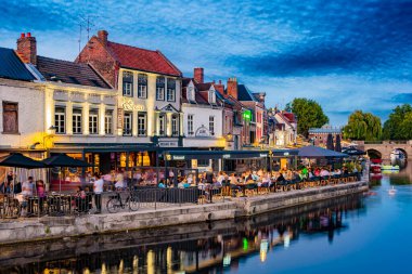 AMIENS, FRANCE - AUG 7, 2022: Restaurants in the old town of Amiens, France after sunset