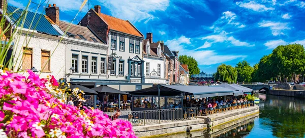 REIMS, FRANCE - AUG 6, 2022: Restaurants at the Somme river in the old town of Amiens, France
