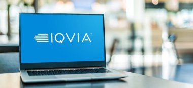 POZNAN, POL - AUG 2, 2022: Laptop computer displaying logo of IQVIA, an American company serving the combined industries of health information technology and clinical research