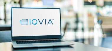 POZNAN, POL - AUG 2, 2022: Laptop computer displaying logo of IQVIA, an American company serving the combined industries of health information technology and clinical research