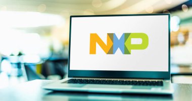 POZNAN, POL - AUG 2, 2022: Laptop computer displaying logo of NXP Semiconductors, an American Dutch semiconductor designer and manufacturer with headquarters in Eindhoven, Netherlands