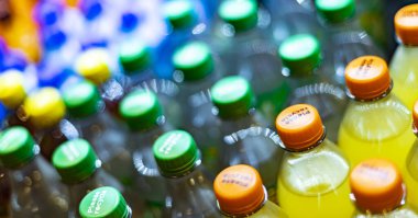 FRANKFURT, GERMANY - AUG 27, 2022: Bottles of cold drinks put out for sale in a commercial refrigerator