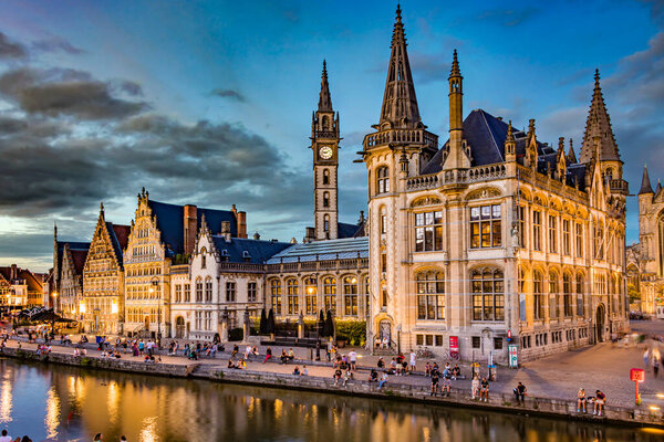 GHENT, BELGIUM - AUG 24, 2022: Architecture of the historic city center of Ghent in the Flemish Region of Belgium, after sunset