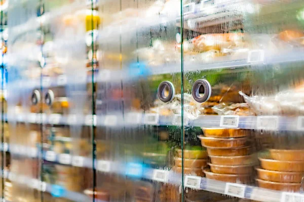 Food products displayed in a commercial refrigerator