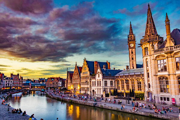 GHENT, BELGIUM - AUG 24, 2022: Architecture of the historic city center of Ghent in the Flemish Region of Belgium, after sunset
