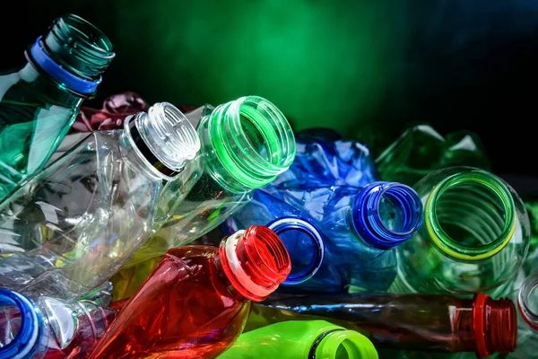 Empty colored drink bottles. Recyclable plastic waste.