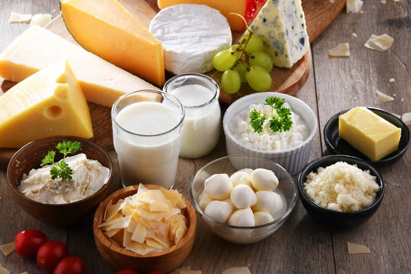A variety of dairy products including cheese, milk and yogurt.