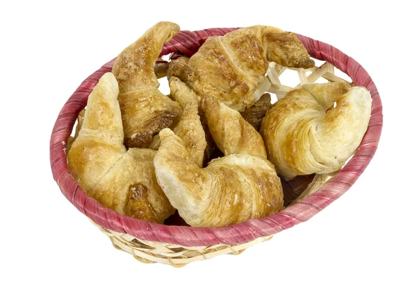 Croissants en una cesta de mimbre — Foto de Stock
