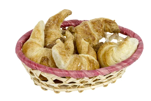 Croissants en una cesta de mimbre —  Fotos de Stock