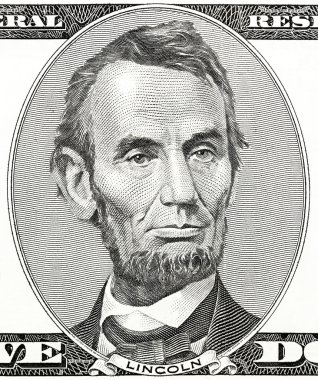 president Abraham Lincoln as he looks on five dollar bill obverse clipart