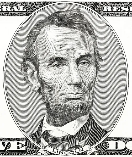 Presidente Abraham Lincoln como él mira en el anverso del billete de cinco dólares —  Fotos de Stock