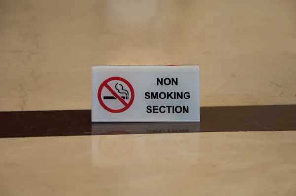 non smoking section sign on table