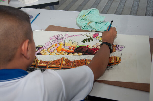 YALA, THAILAND - AUG 29: Yala young male student kid draws pictu
