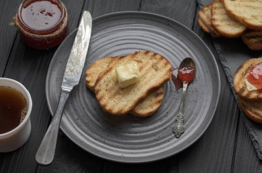 Continental Breakfast meal served with coffee, toast, jam and butter. Delicious coffee table.