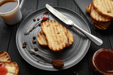 Continental Breakfast meal served with coffee, toast, jam and butter. Delicious coffee table.