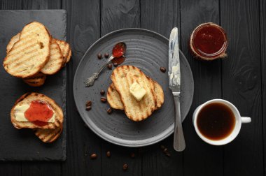 Continental Breakfast meal served with coffee, toast, jam and butter. Delicious coffee table.