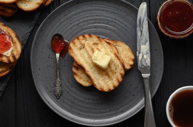 Continental Breakfast meal served with coffee, toast, jam and butter. Delicious coffee table.