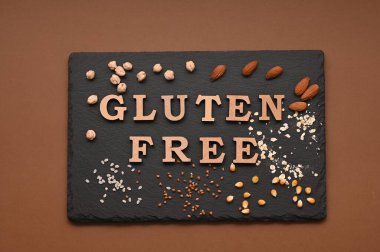 Gluten free text and spoons of various gluten free flour. Flat lay, top.