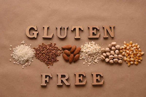 Gluten free text and gluten free products on brown background.