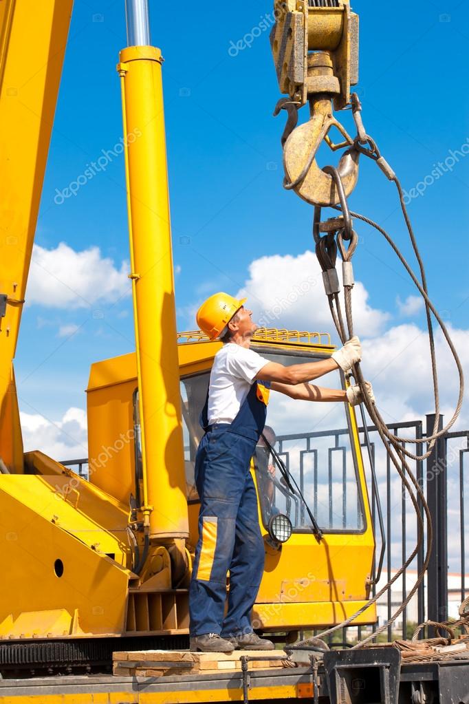 Construction worker during hoisting works — Stock Photo © Bambulla