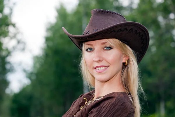Pretty girl in a cowboy hat Royalty Free Stock Photos