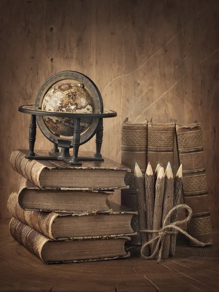 Stack of books and globe — Stock Photo, Image