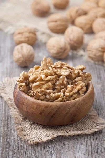 Walnuts in wooden bowls — Stock Photo, Image