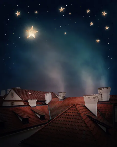 Rooftops and night sky — Stock Photo, Image